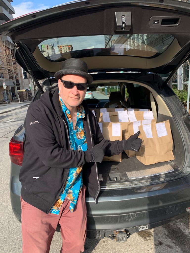 Andrew Milne, CRO, Field Effect, has his trunk full of meals to be delivered to the Field Effect team. 