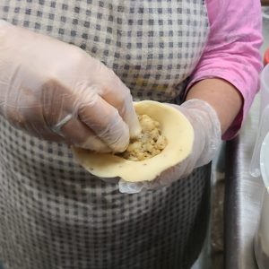 Technique of hand forming samosas - with Ottawa Samosa