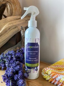 An image of a spray natural surface cleaner - surrounded by lavendar.